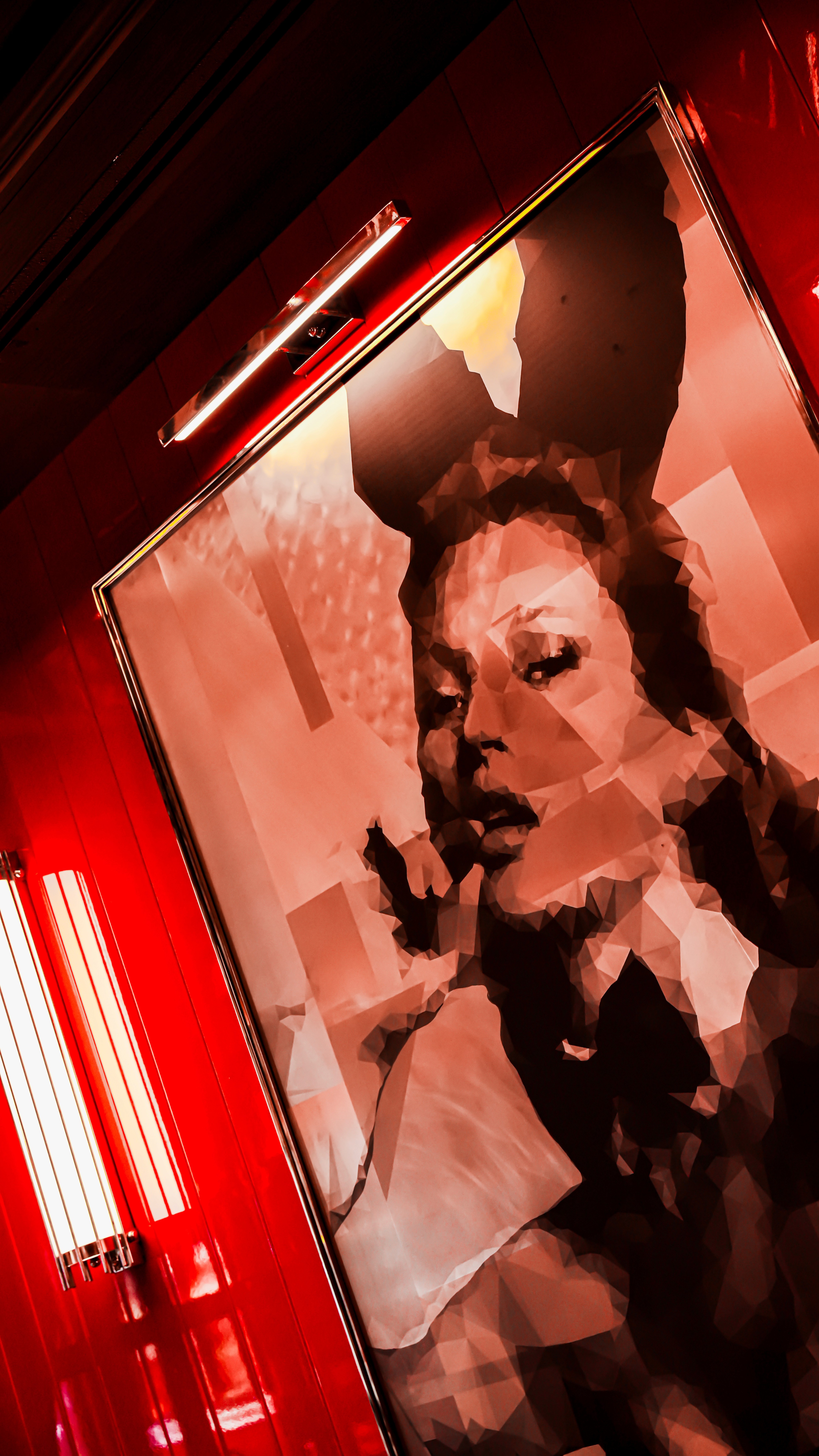 Table with open book, tea and pillows spread around