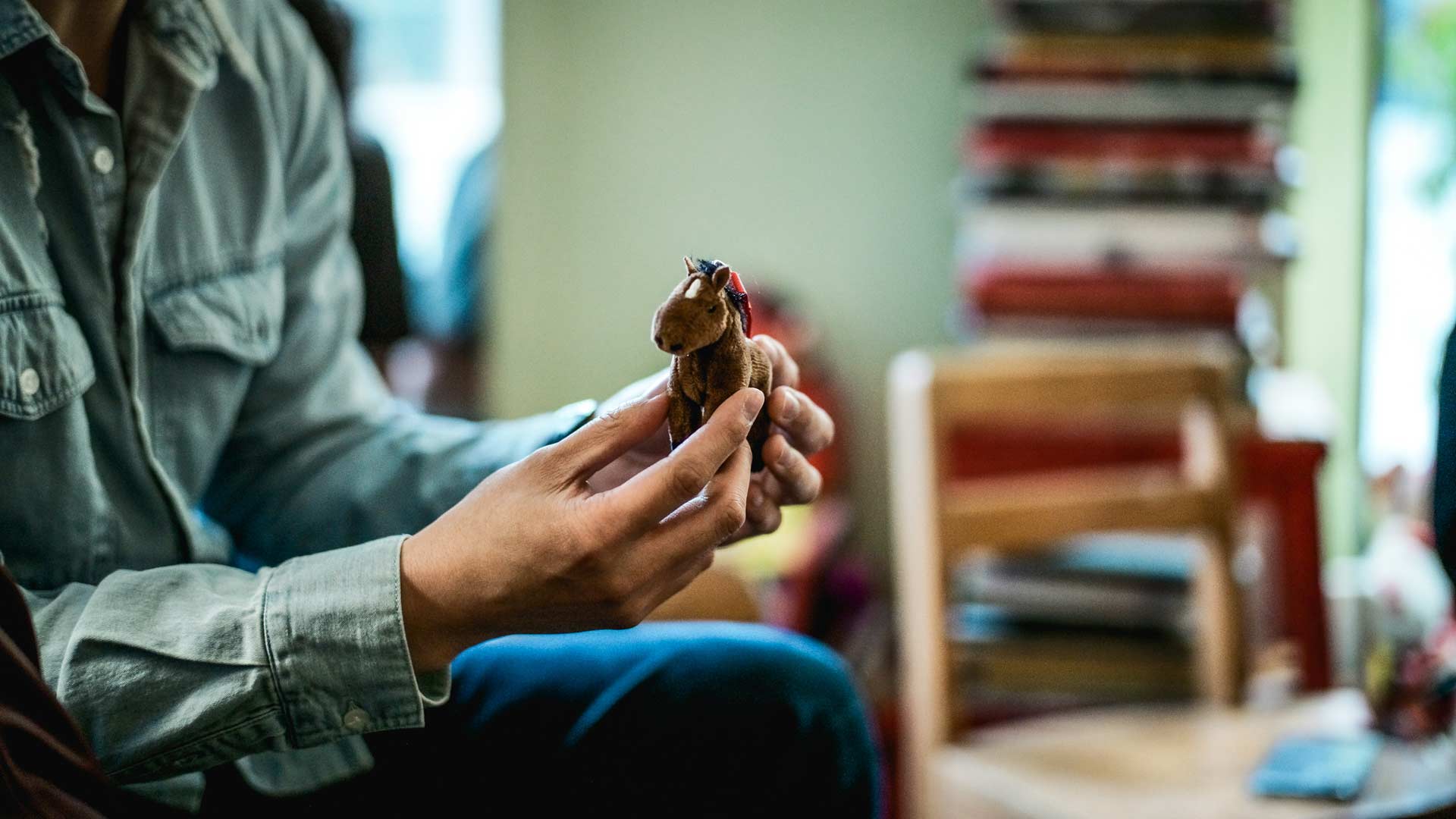 dorothy globus studio person holding a miniature horse toy