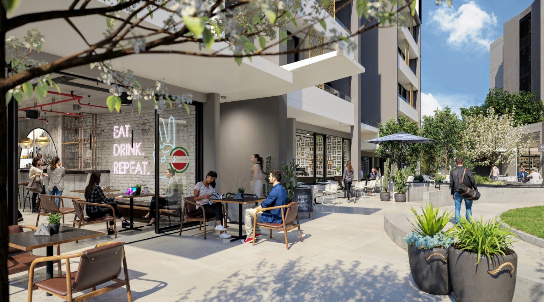 Ground-level retail and café spaces at Kew Tallawong with outdoor seating, greenery, and a walkable community-focused atmosphere.