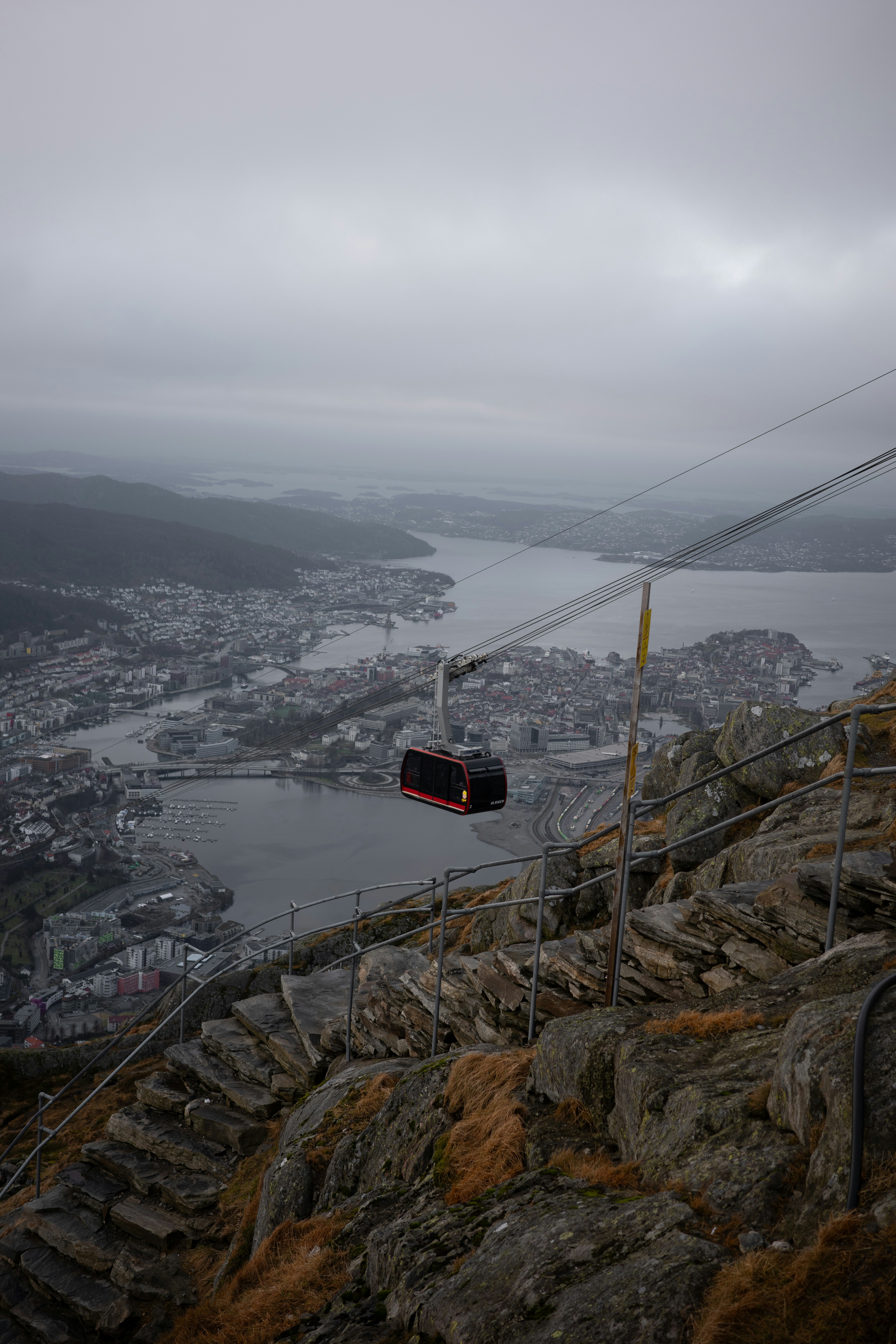 Cityscape at sunset with a mountain in the background