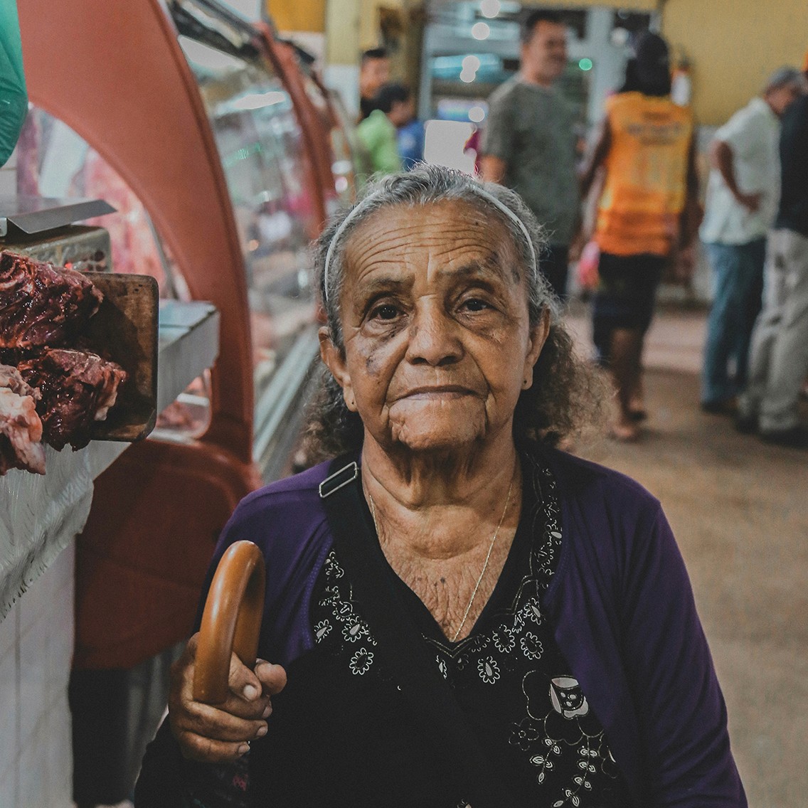 An elderly lady looking at the camera