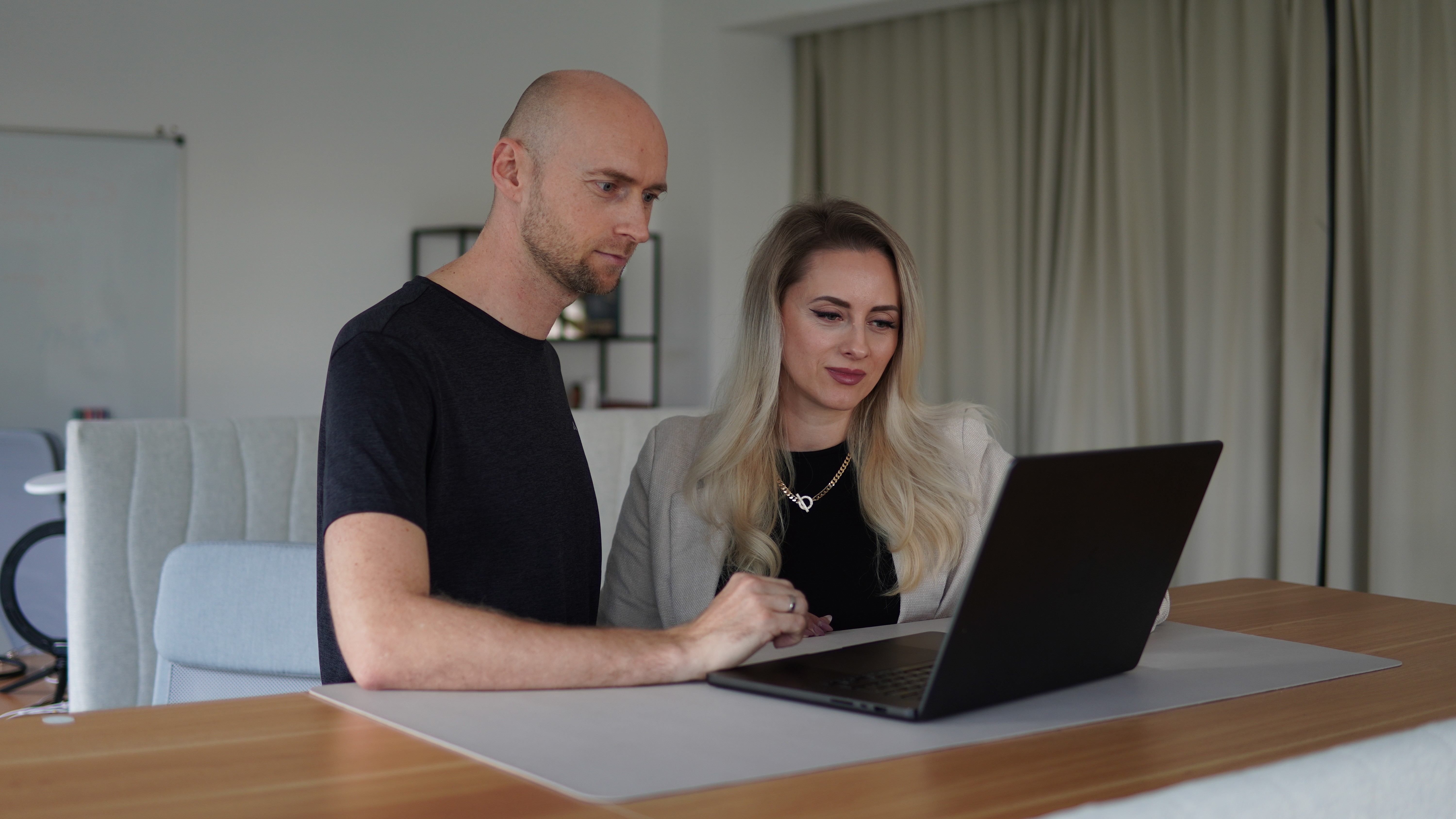 A stylish girl holding a laptop
