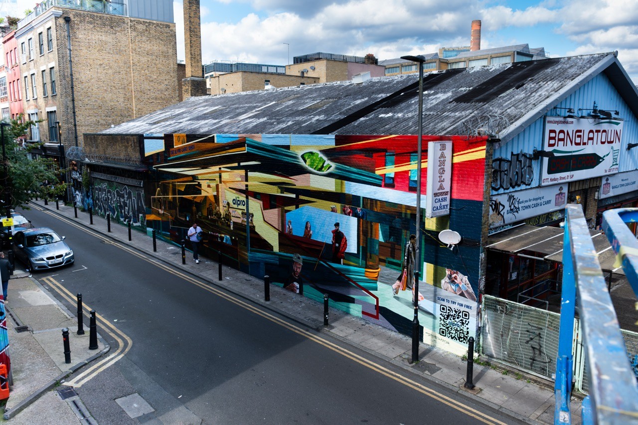 Woman wears a blue coat in a blue environment.