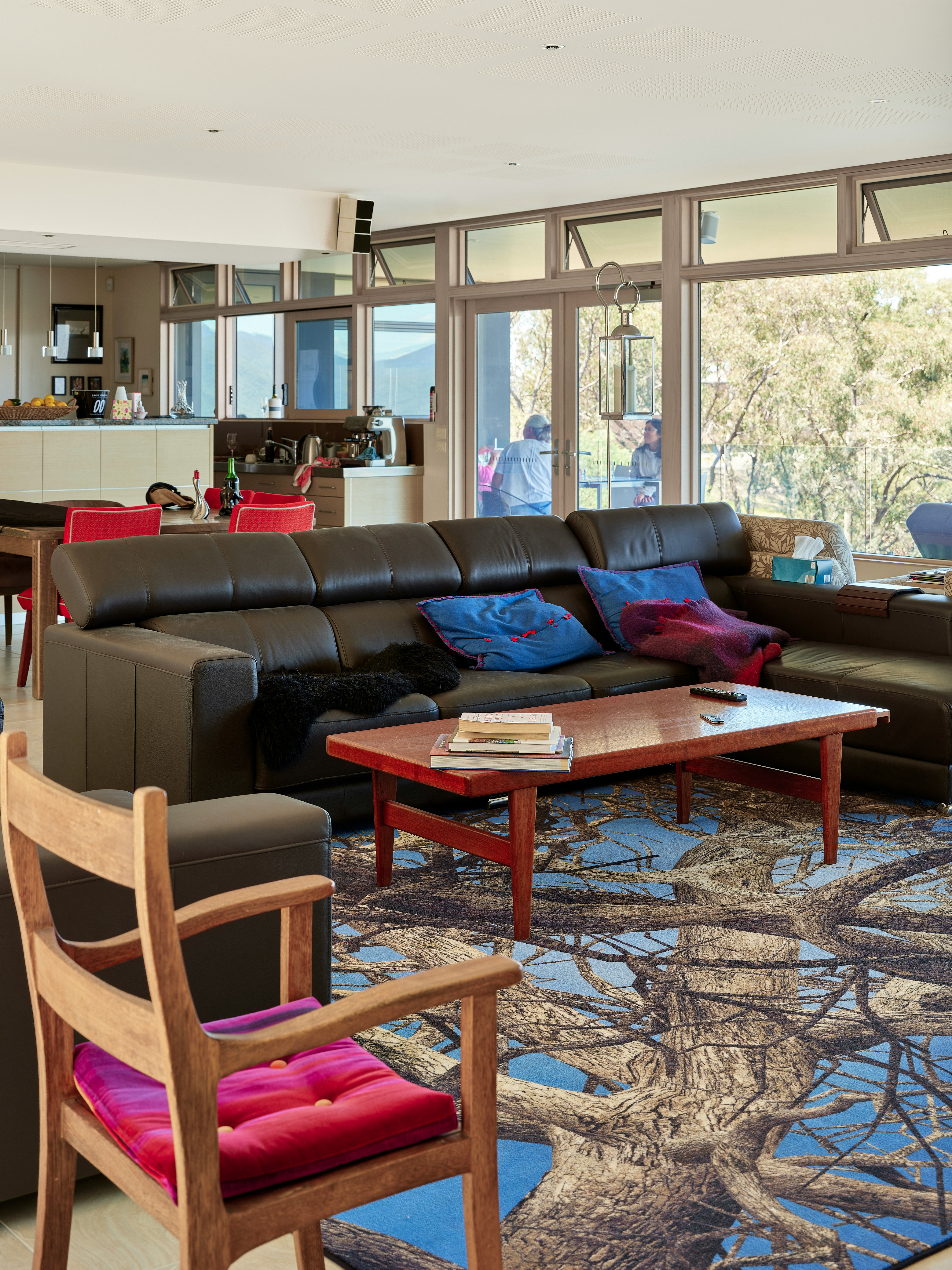 A living room filled with furniture and a large window