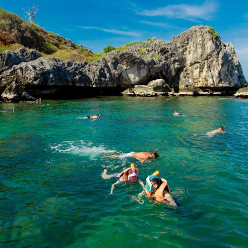 Set off to the pristine "Koh Wow" for snorkeling in crystal-clear waters.