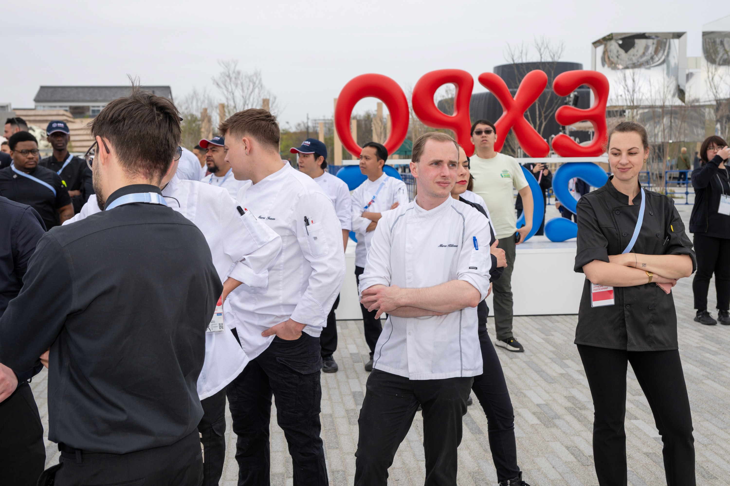 a table topped with plates of food next to a tray of food