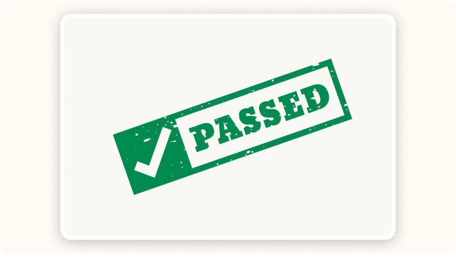 Green “Passed” stamp with checkmark on white background