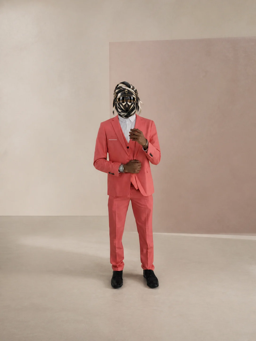 Full-length view of Dusty Rose, a dusty-rose two-piece suit with a white shirt and black dress shoes, with the official Marzelest face covering.