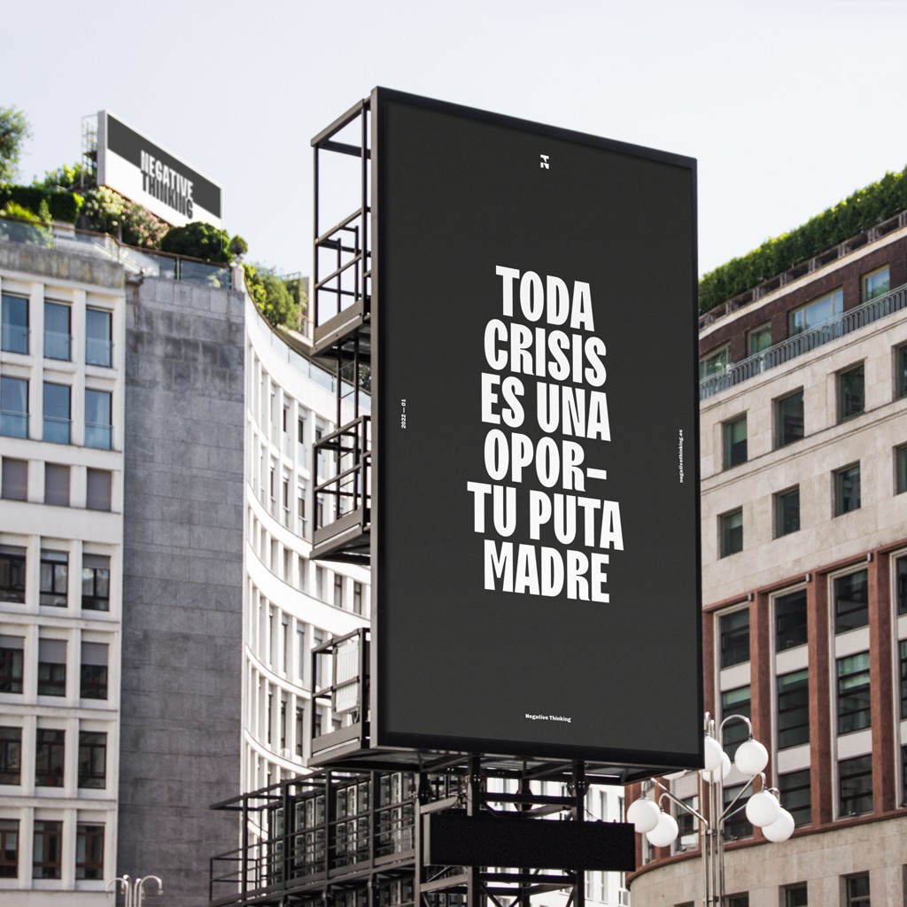 Person sitting on a ledge overlooking New York City skyline