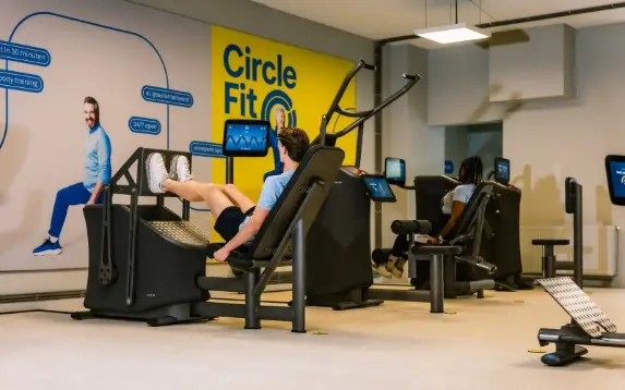 A gym interior with modern equipment.