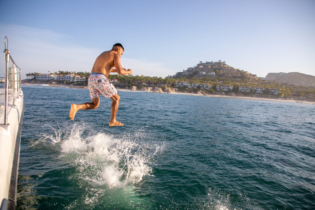 Surfer cleaning Surf board