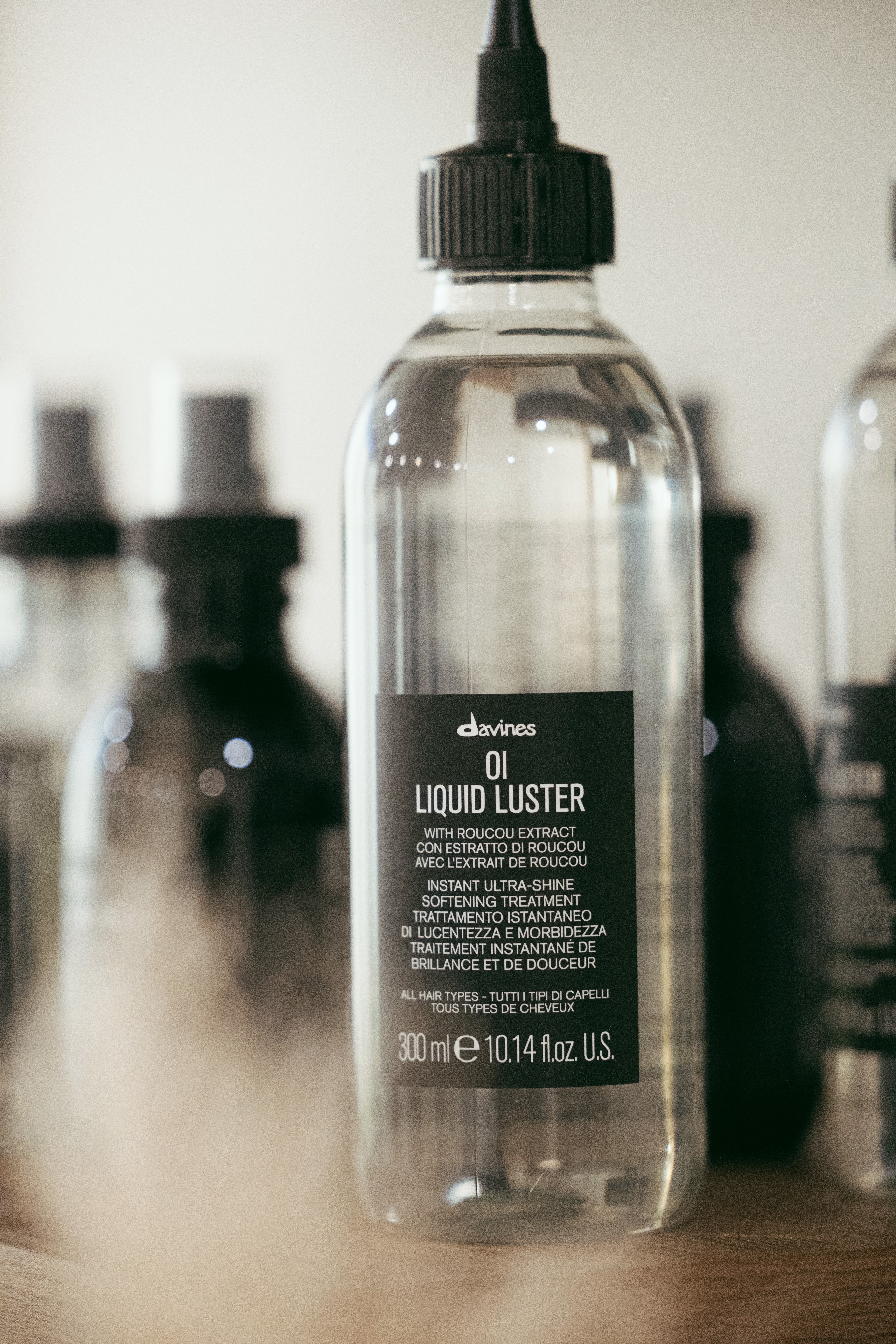 A serene spa setting with two lounge chairs beside a warm, reflective pool and soft, natural lighting.