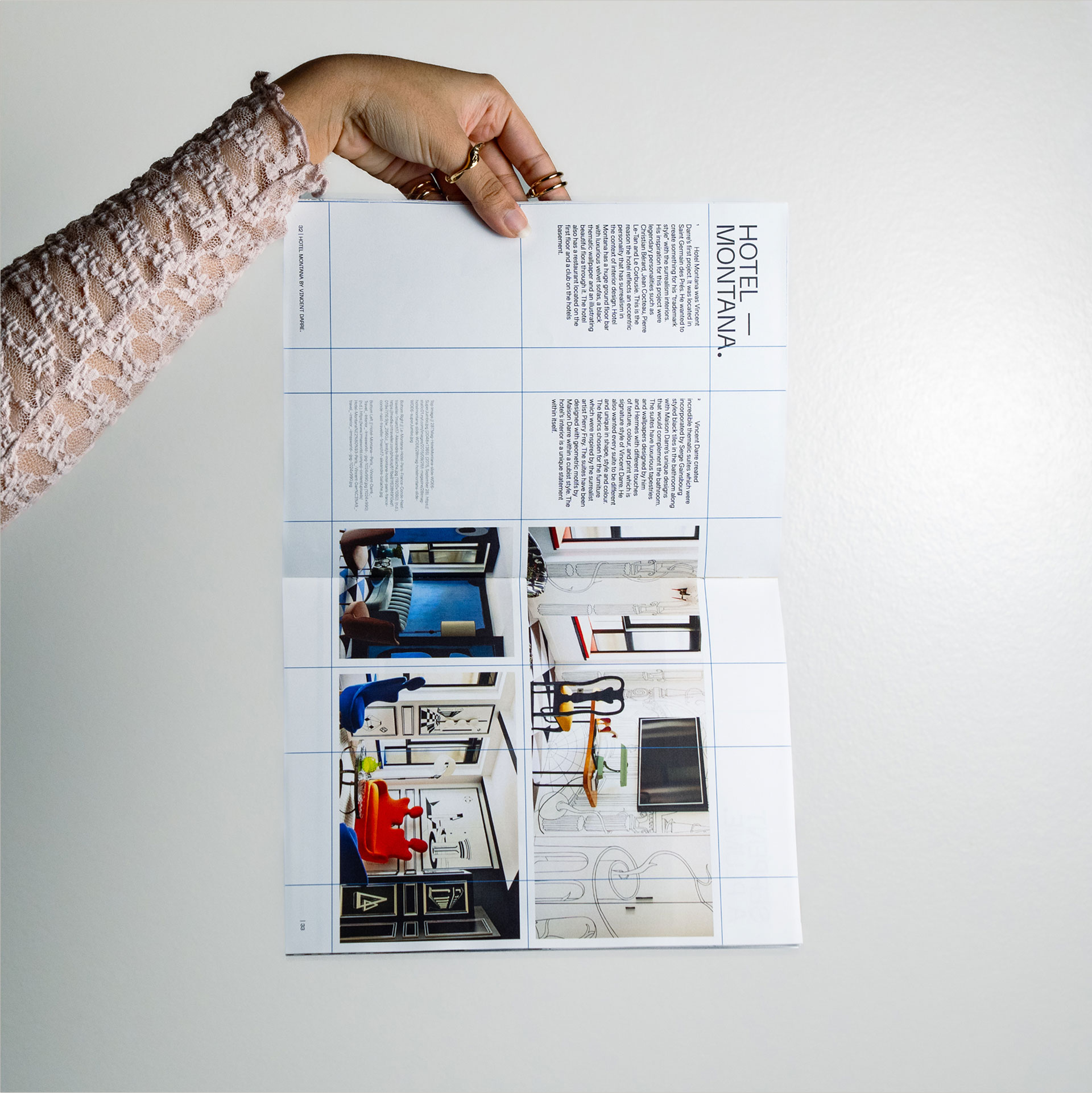 A person holds an open brochure against a plain background, showcasing interior designs and details of Hotel Montana, with photos featuring modern and elegant decor.