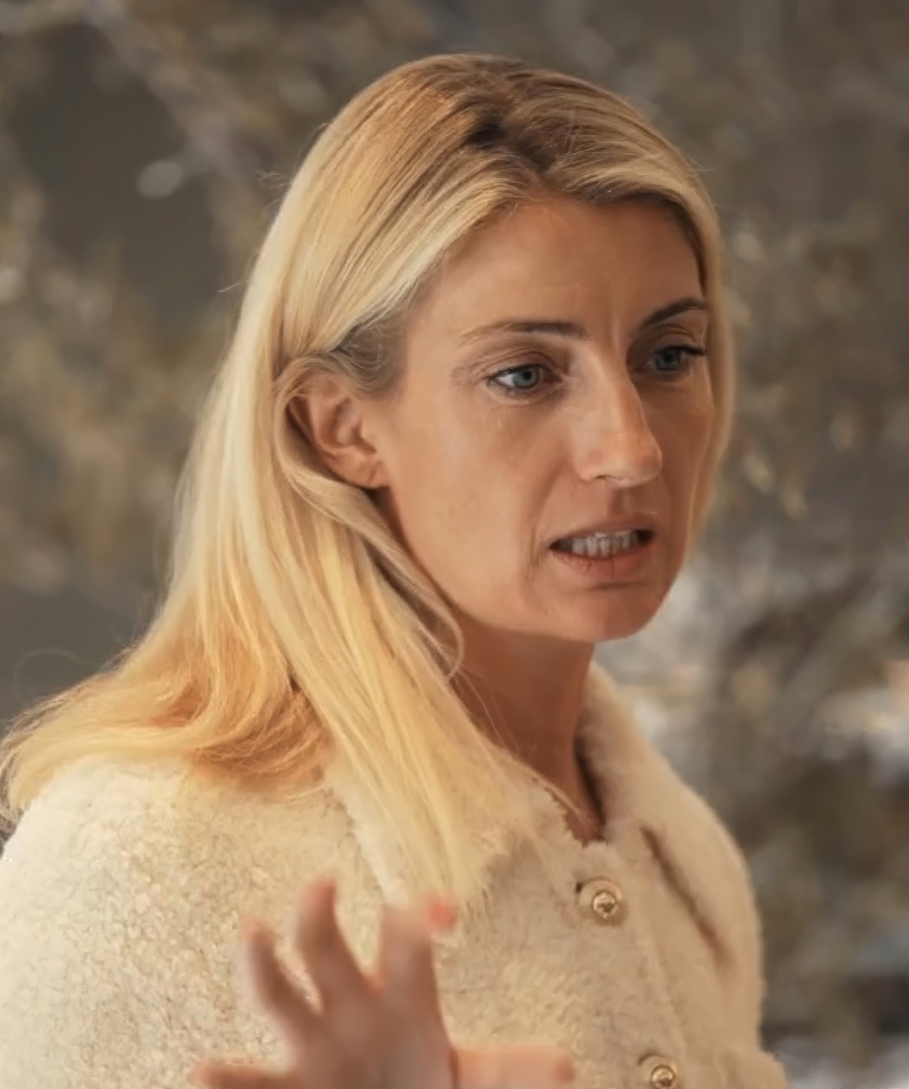 Close-up of bride and groom's torsos, bride in white dress
