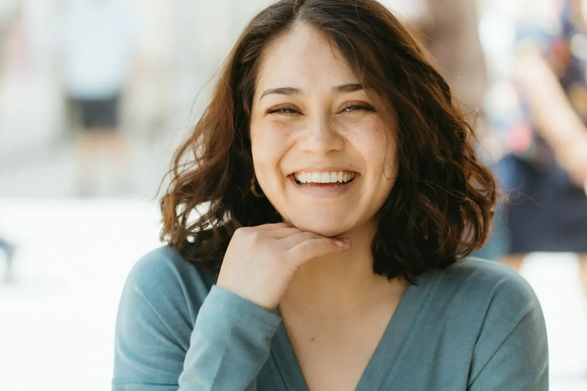 A young woman smiling showing her teeth
