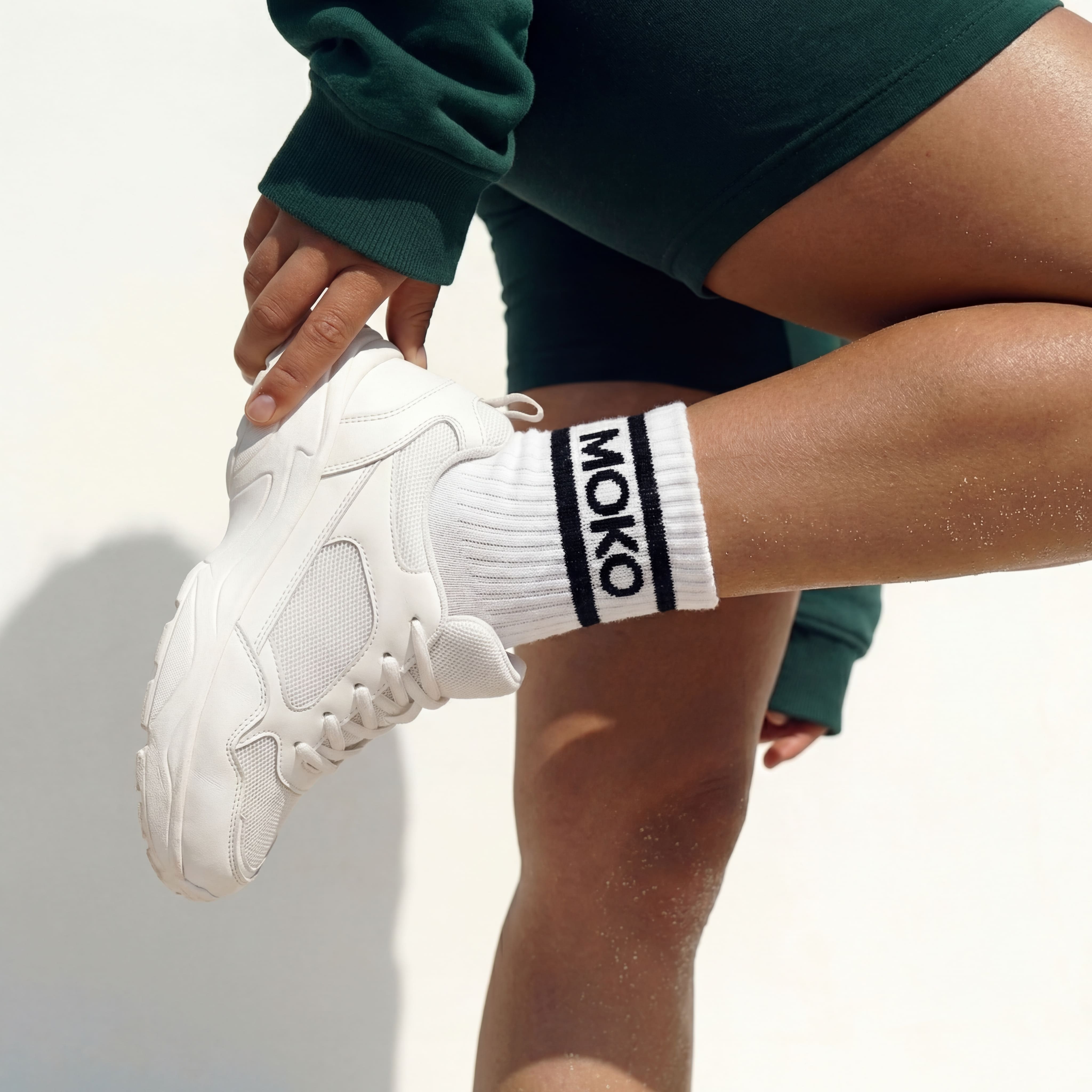 Signature white MokoBoko branded socks and a pair of white sneakers