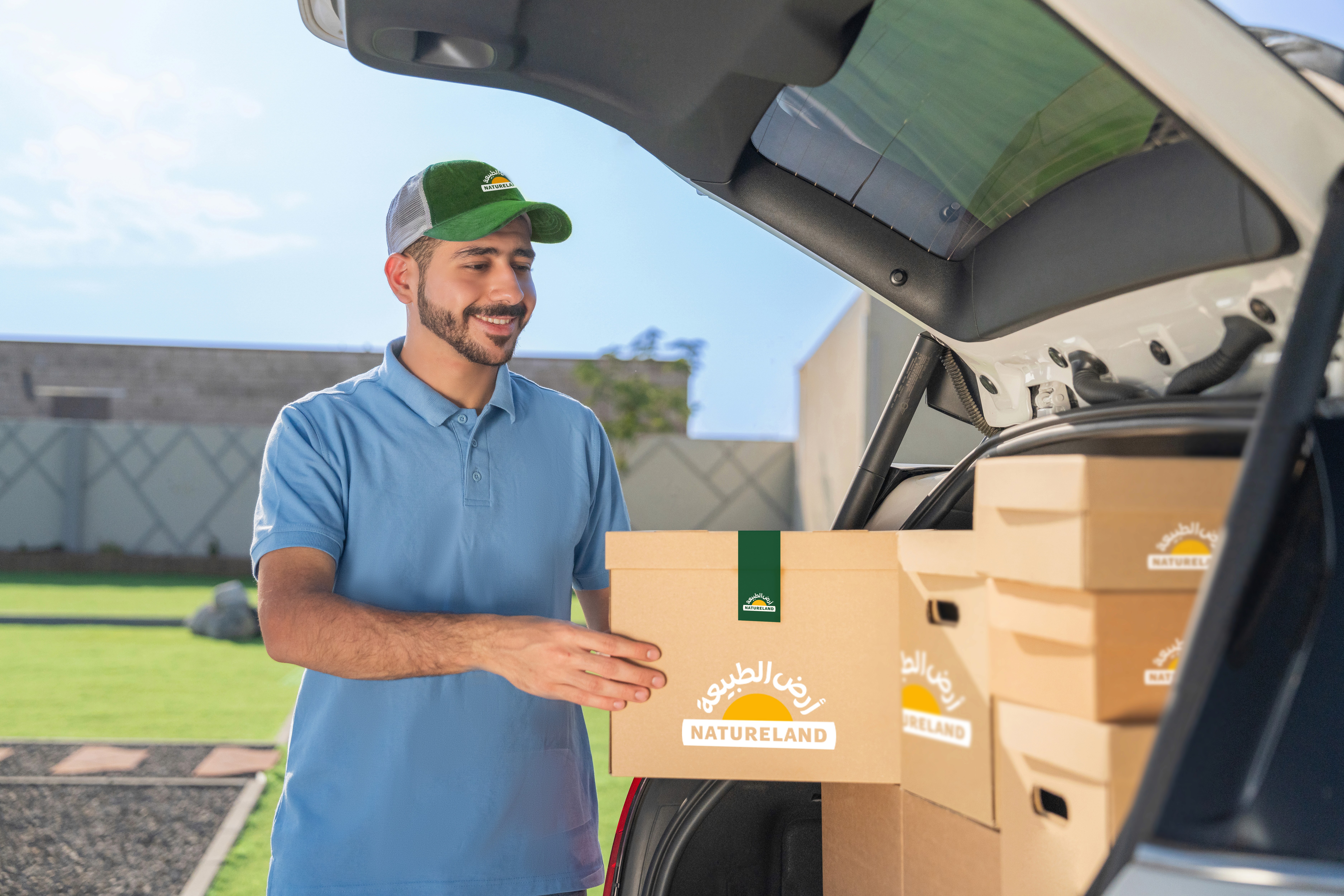 Man receiving products ordered through app developed by Nizek