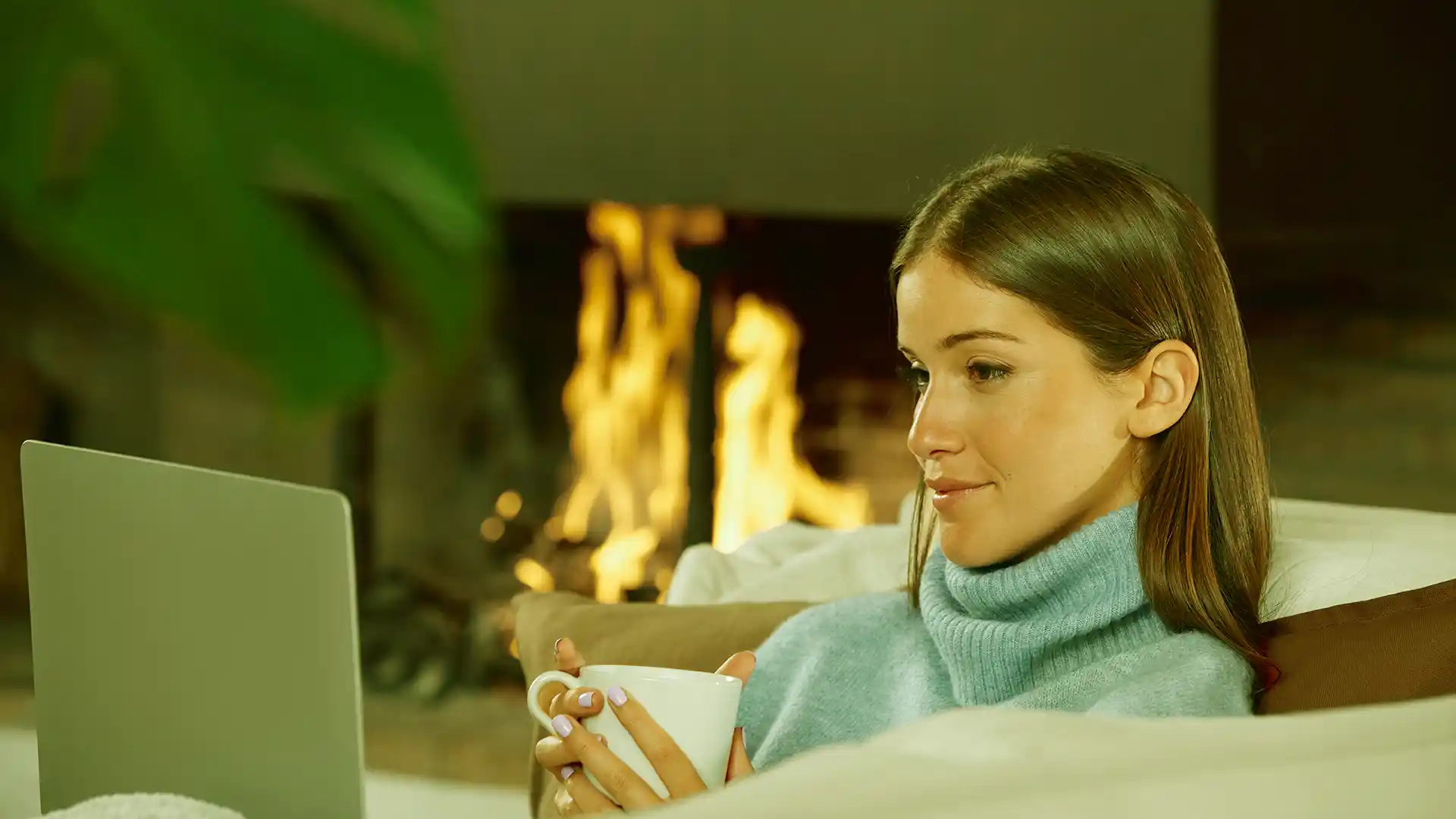 woman enjoying the fire in the fireplace safely and secure