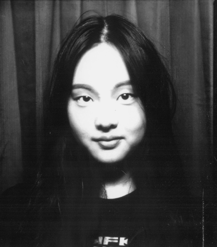 Photographer directing model in a studio setting