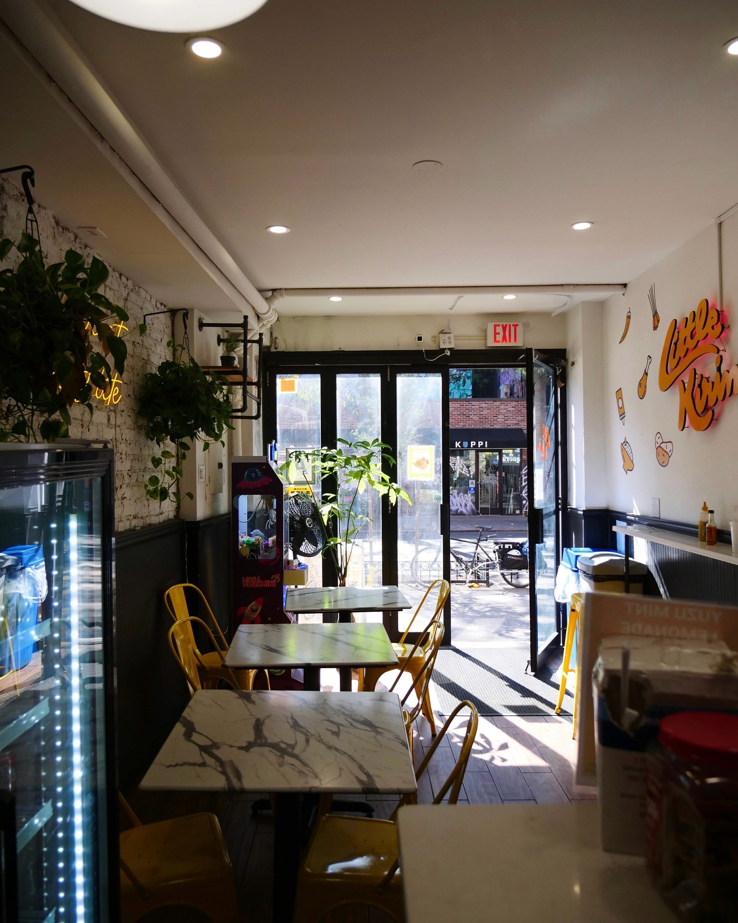 Little Kirin’s Cozy Interior in East Village: A warm and inviting interior with limited seating, perfect for an intimate dining experience. Features modern decor with subtle nods to Asian-inspired aesthetics.