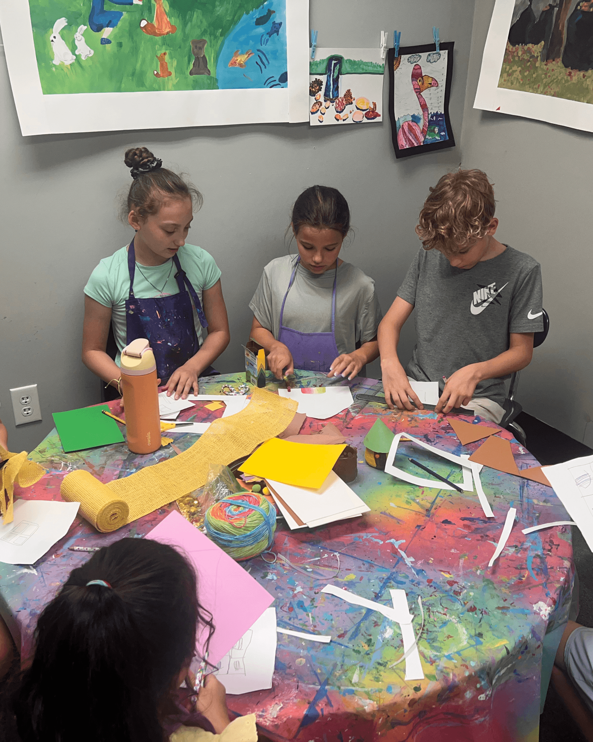 Children participating in a creative enrichment activity at SportPlus Academy