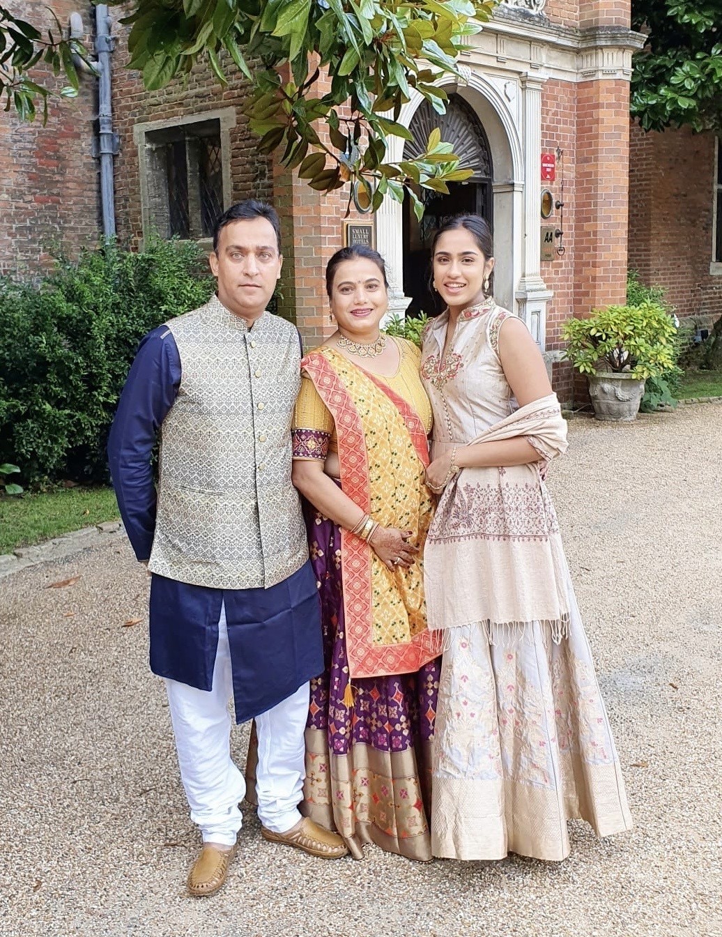 Chan Patel with family outside a heritage building in England, representing the roots behind TENDS