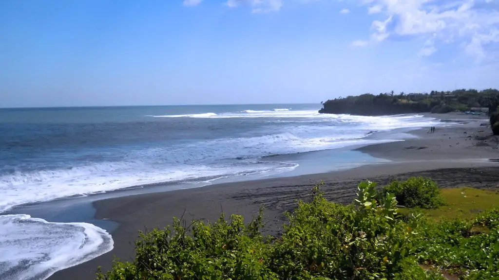 Pristine black sand coastline at Nyanyi, showcasing the natural beauty of this prime property location.