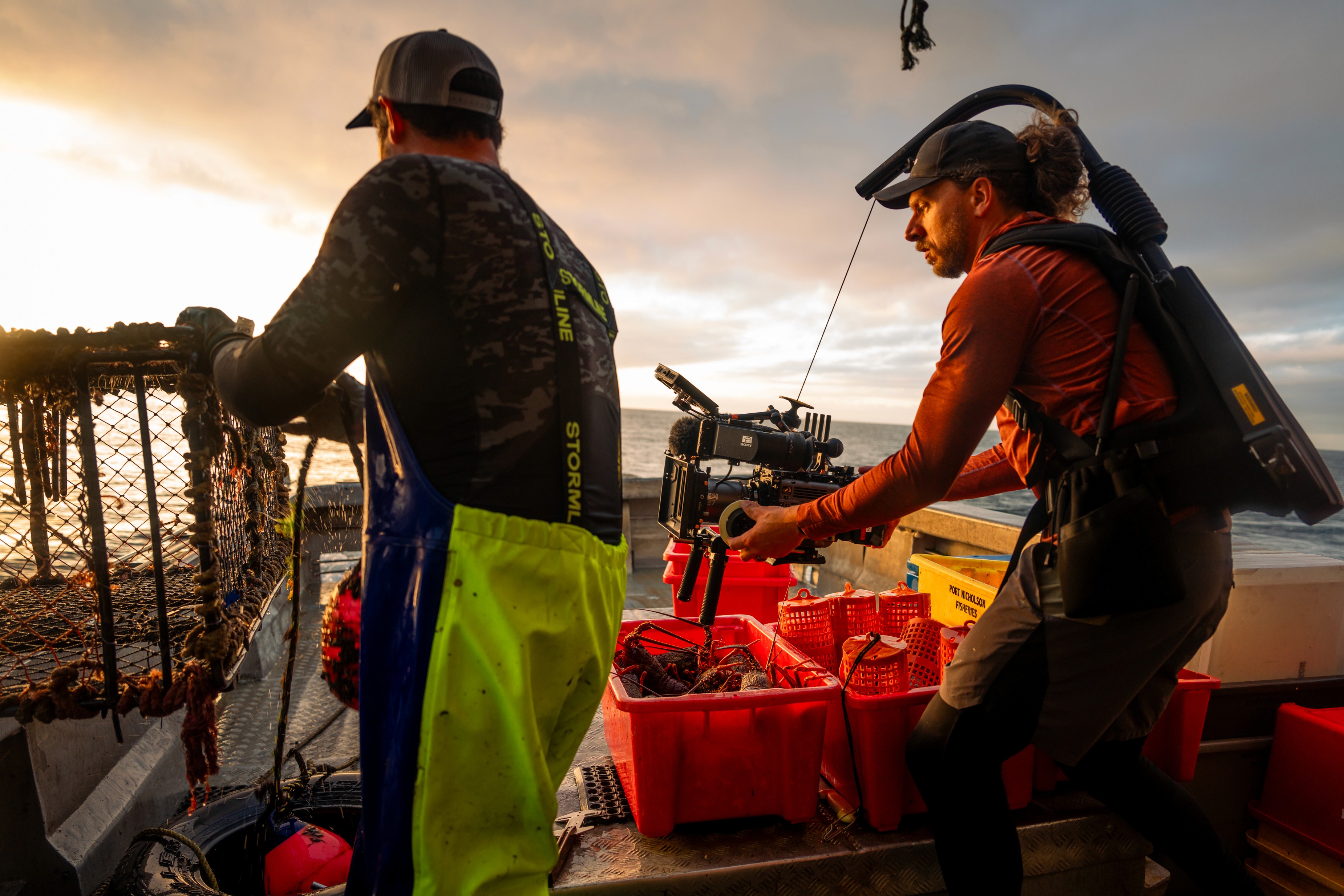 a cameraman on a boat