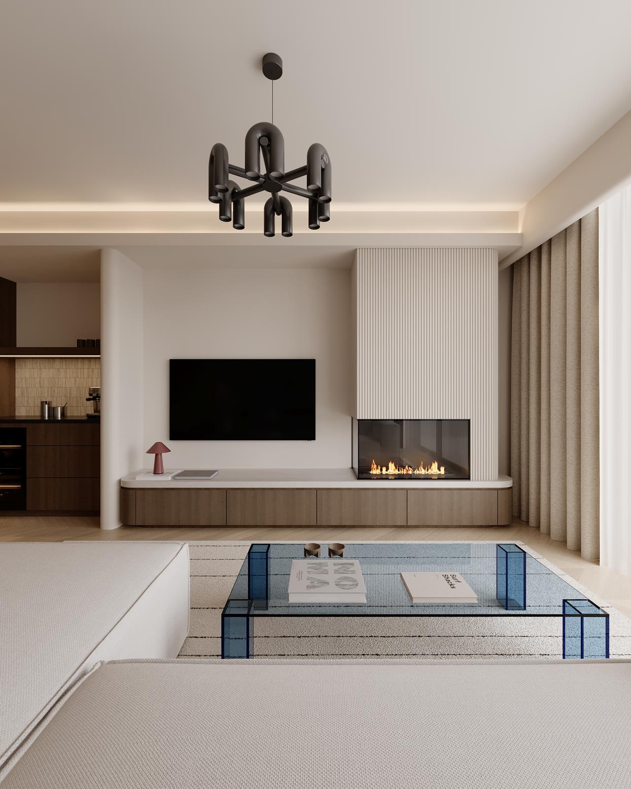 A modern living room featuring a light fixture, TV unit, and cozy seating area with neutral tones.