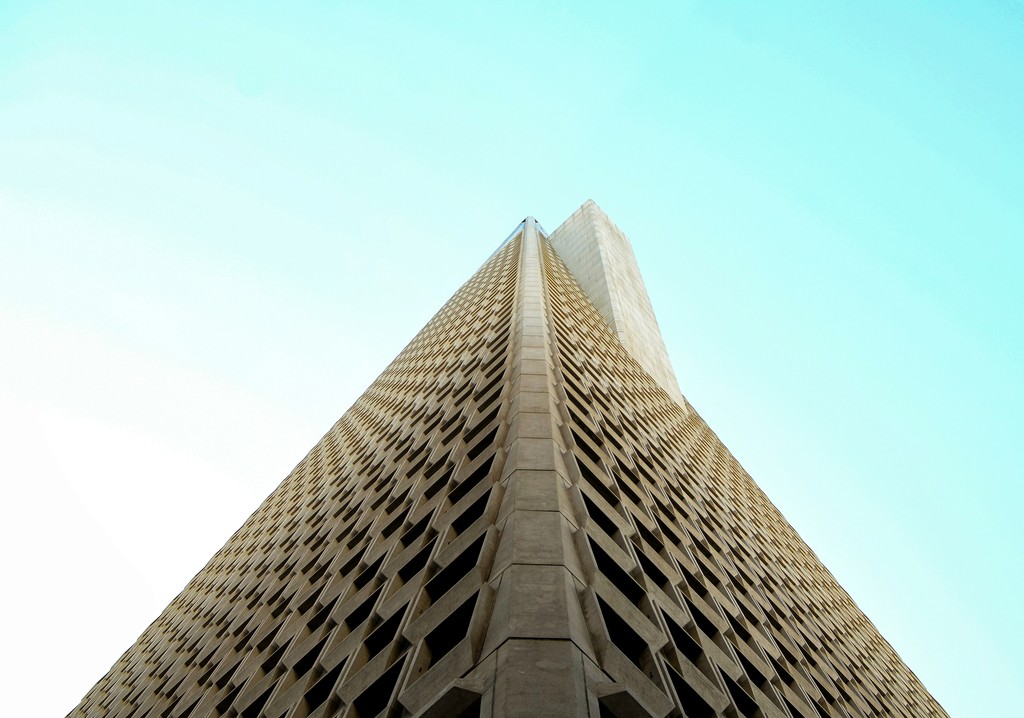 low-angle photography of beige high-rise building