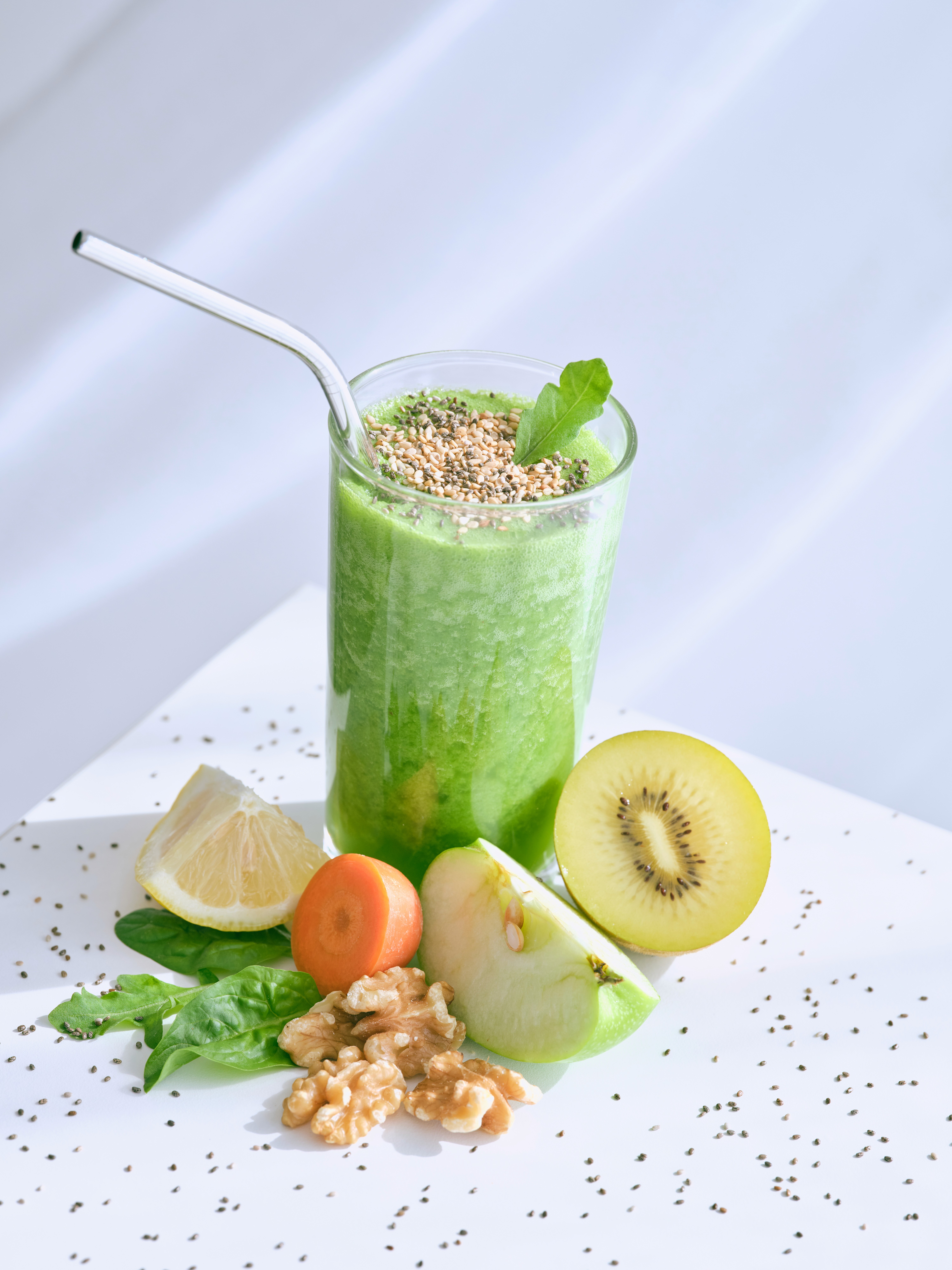 Green smoothie with fresh fruits and vegetables, representing a focus on health and wellbeing