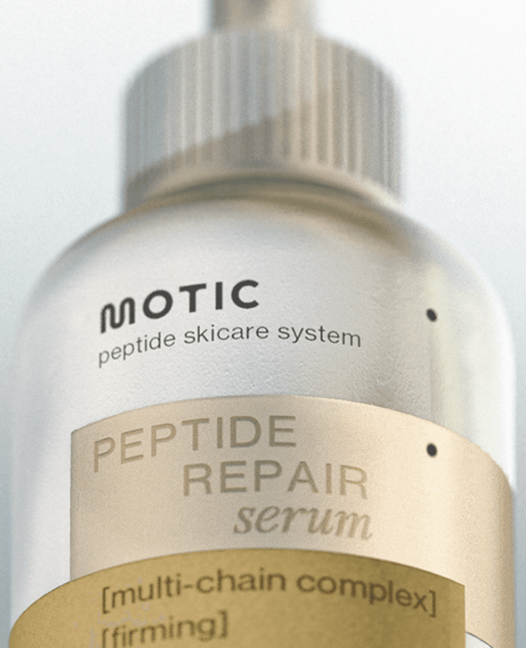 Three people in conversation with warm lighting, including a person wearing a hat and another person wrapped in what appears to be a textured shawl or sweater.