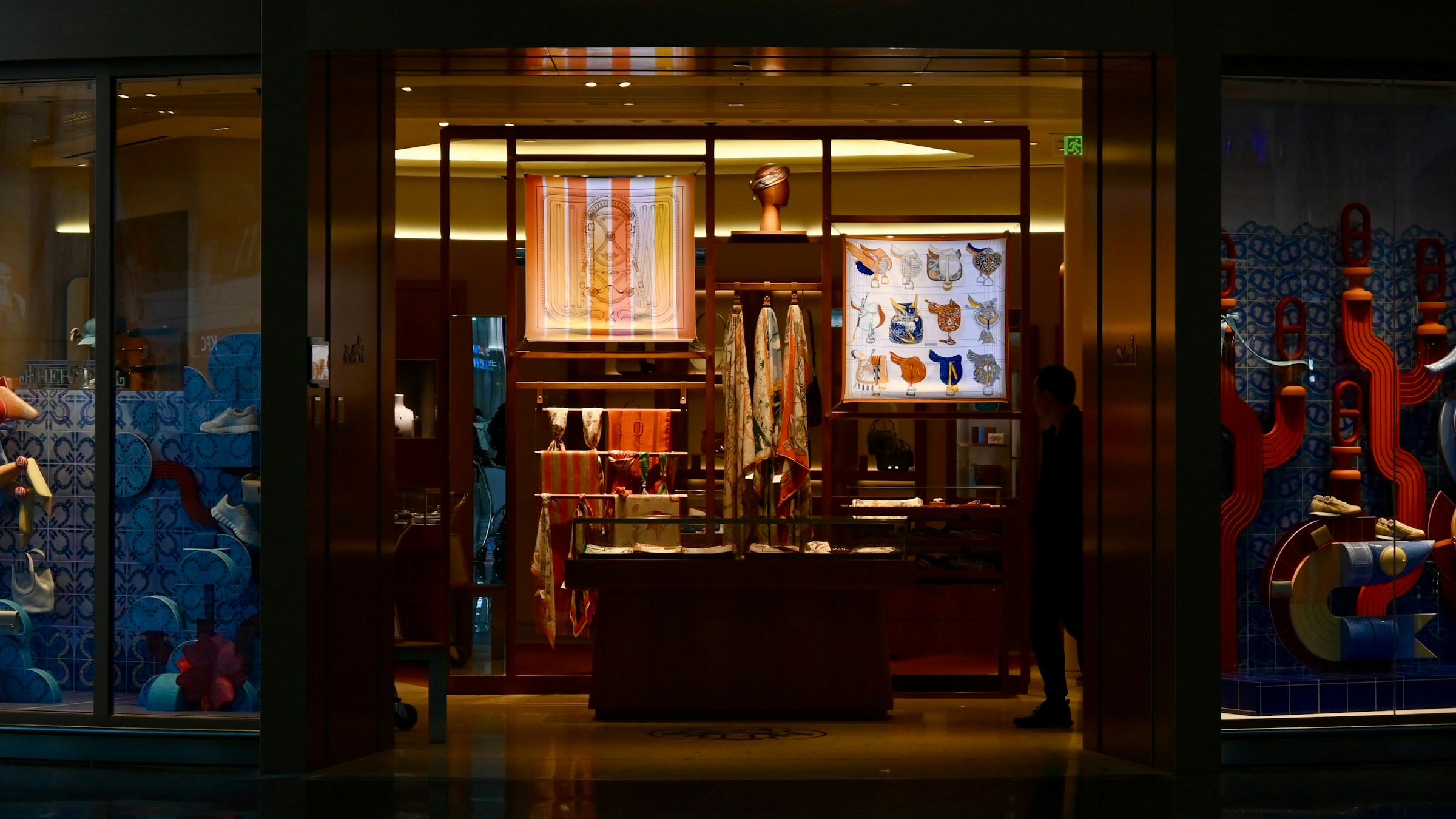 Luxury boutique storefront at dusk