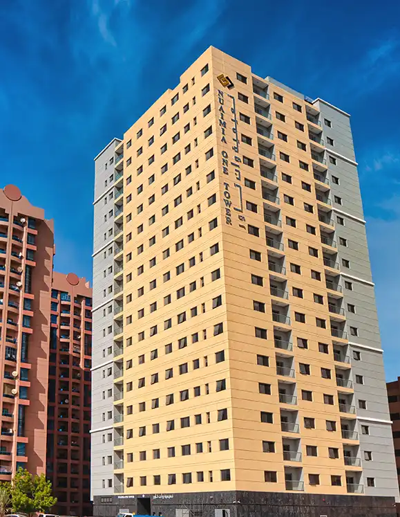 Side profile of Al Nuaimia One Tower highlighting balconies and high-rise architecture.