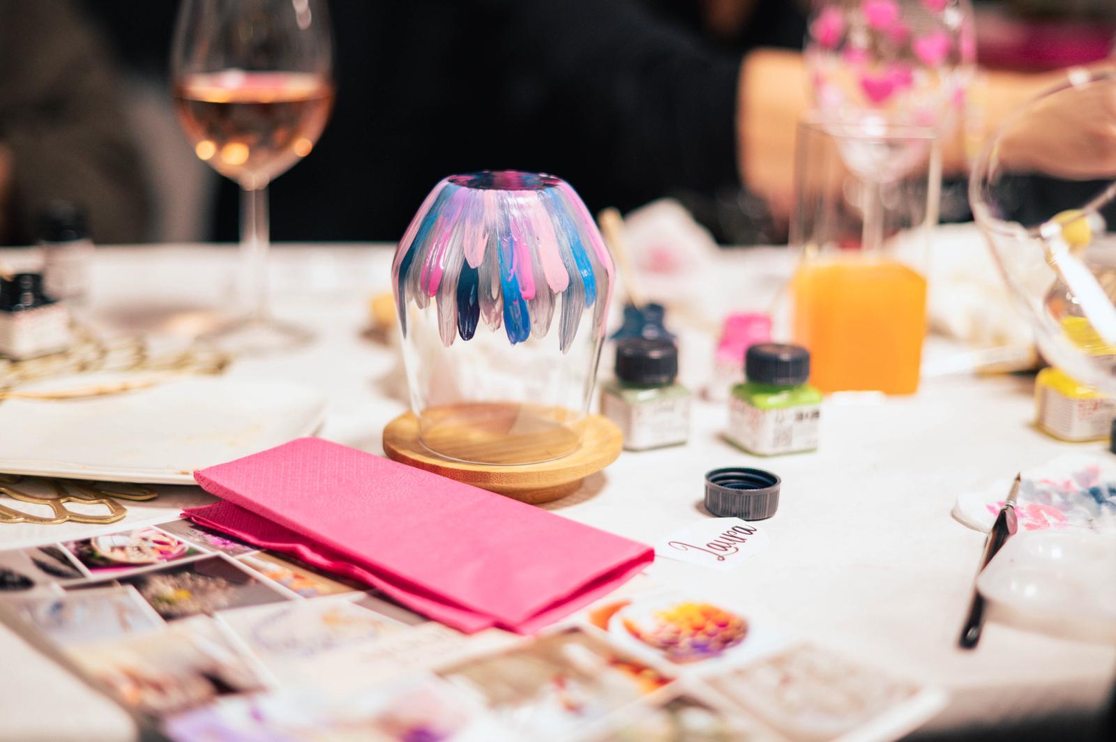 A bride in a lace wedding dress gently holds.