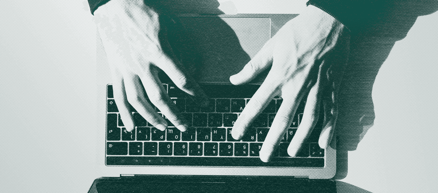 Close-up image of hands typing on a laptop keyboard with a high-contrast, textured green overlay, representing digital communication and the importance of accessible email design.
