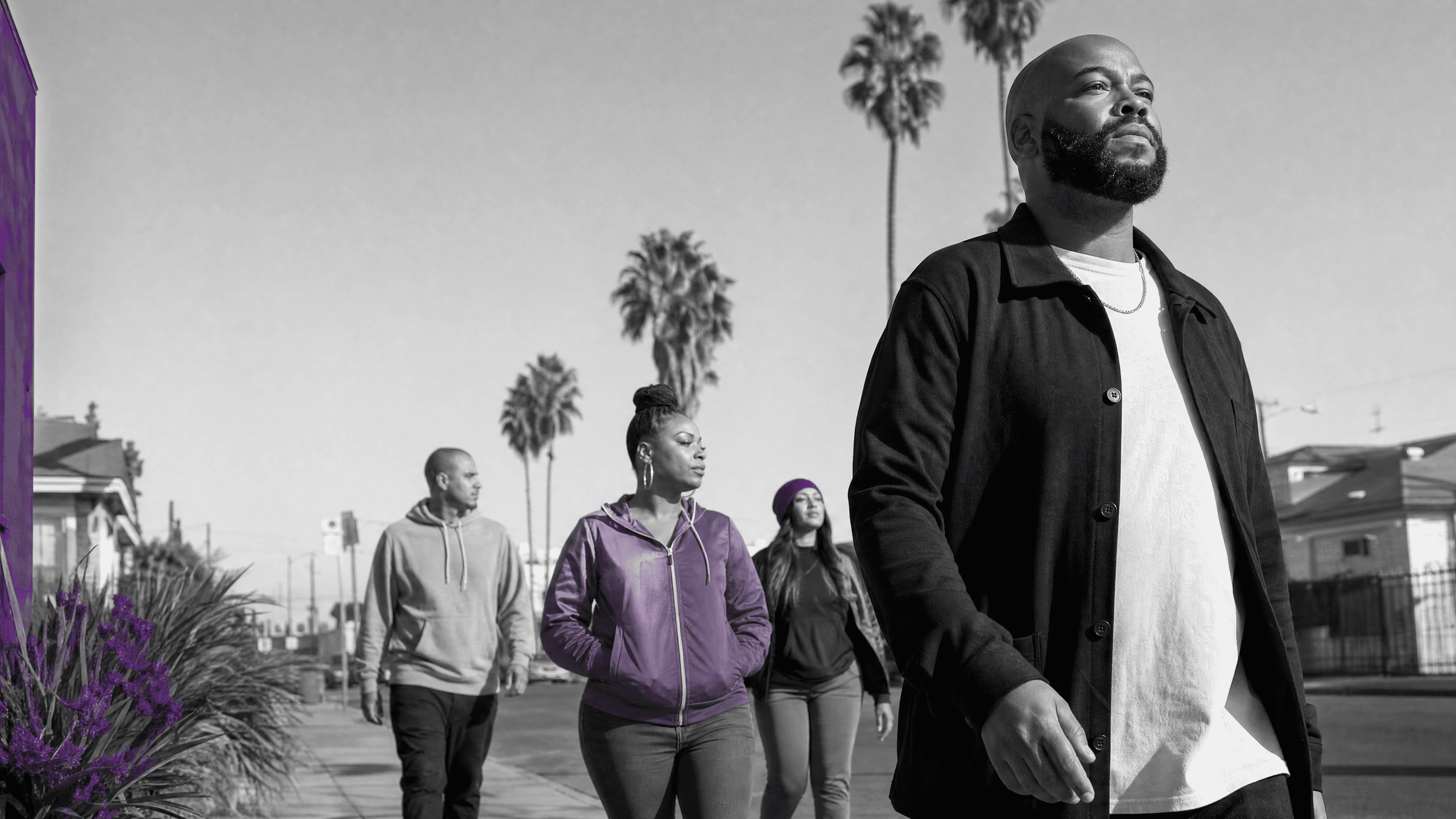Justice-impacted adults moving forward through a South Los Angeles community.