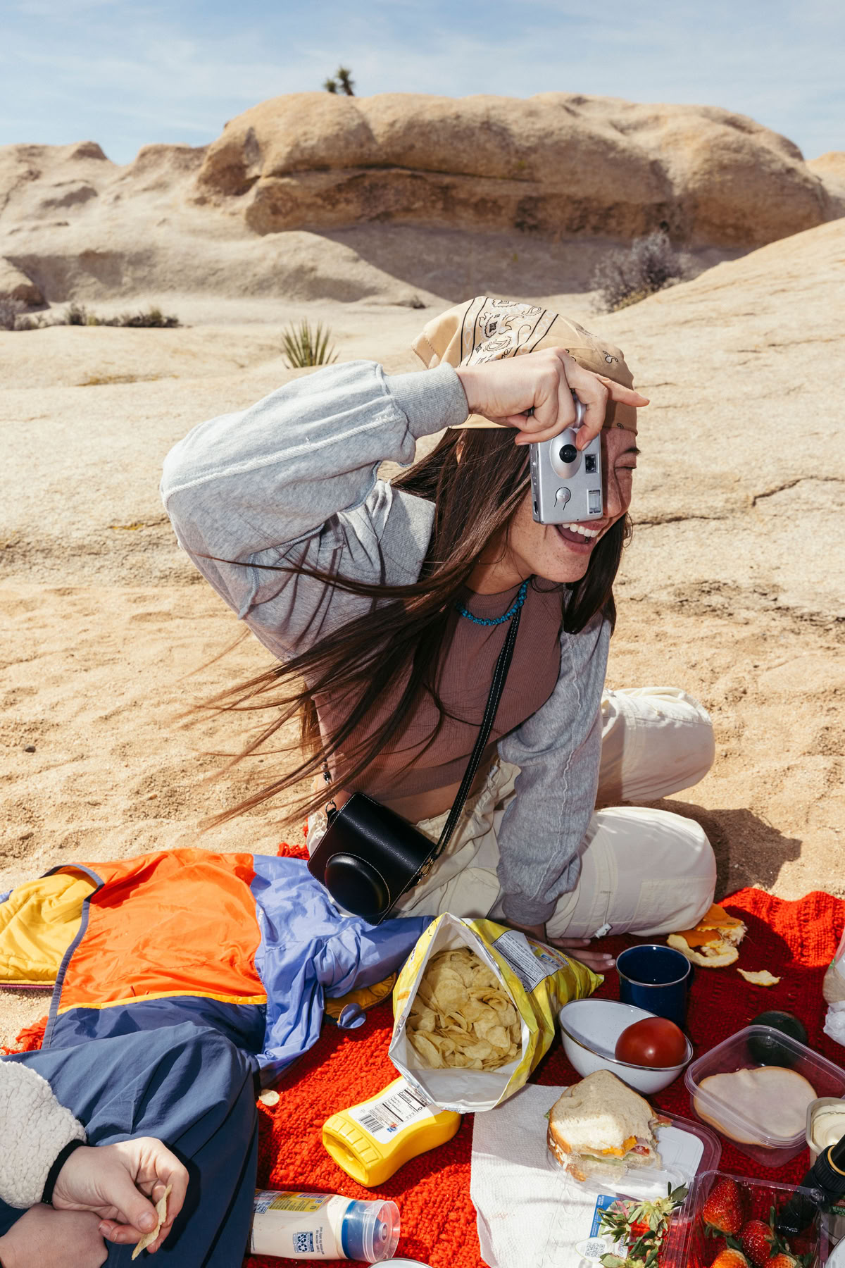 two man facing one woman under white and blue sky at daytime