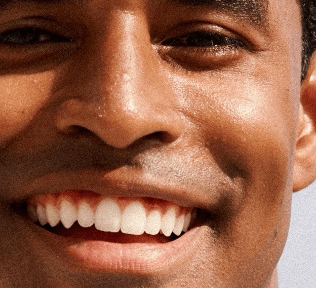 Black man smiling close up