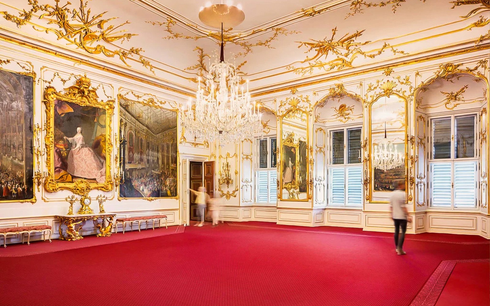 Artworks and chandelier in Schönbrunn Palace interior, Vienna.