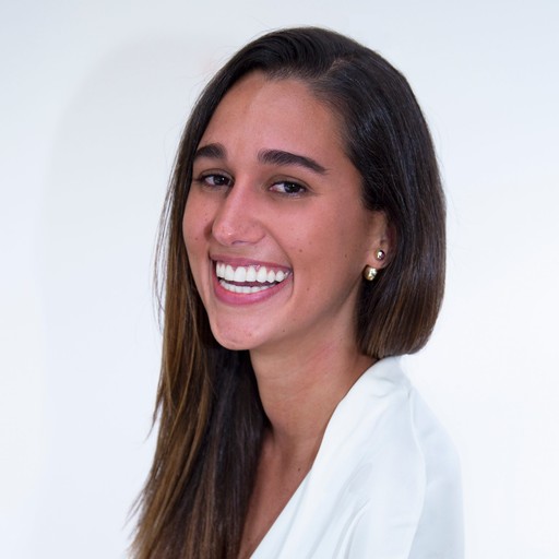 Maria T Carmona professional headshot photo in a white shirt and background