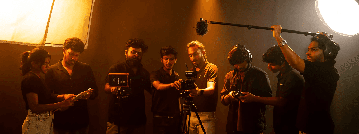 A team at work setting up lights and equipment indoors, focusing on media production activities by tapecassette