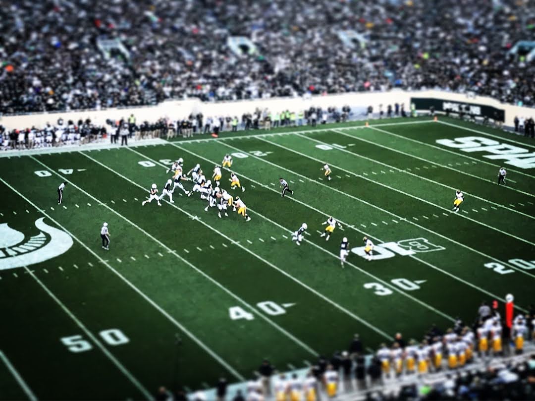 A football game unfolds on the field, capturing the intense moment of Super Bowl XXV's dramatic conclusion.