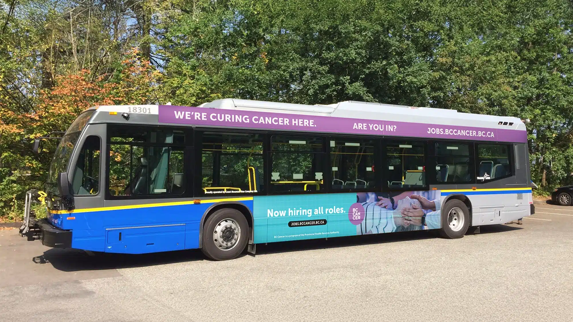 A bus parked, showing campaign advertising