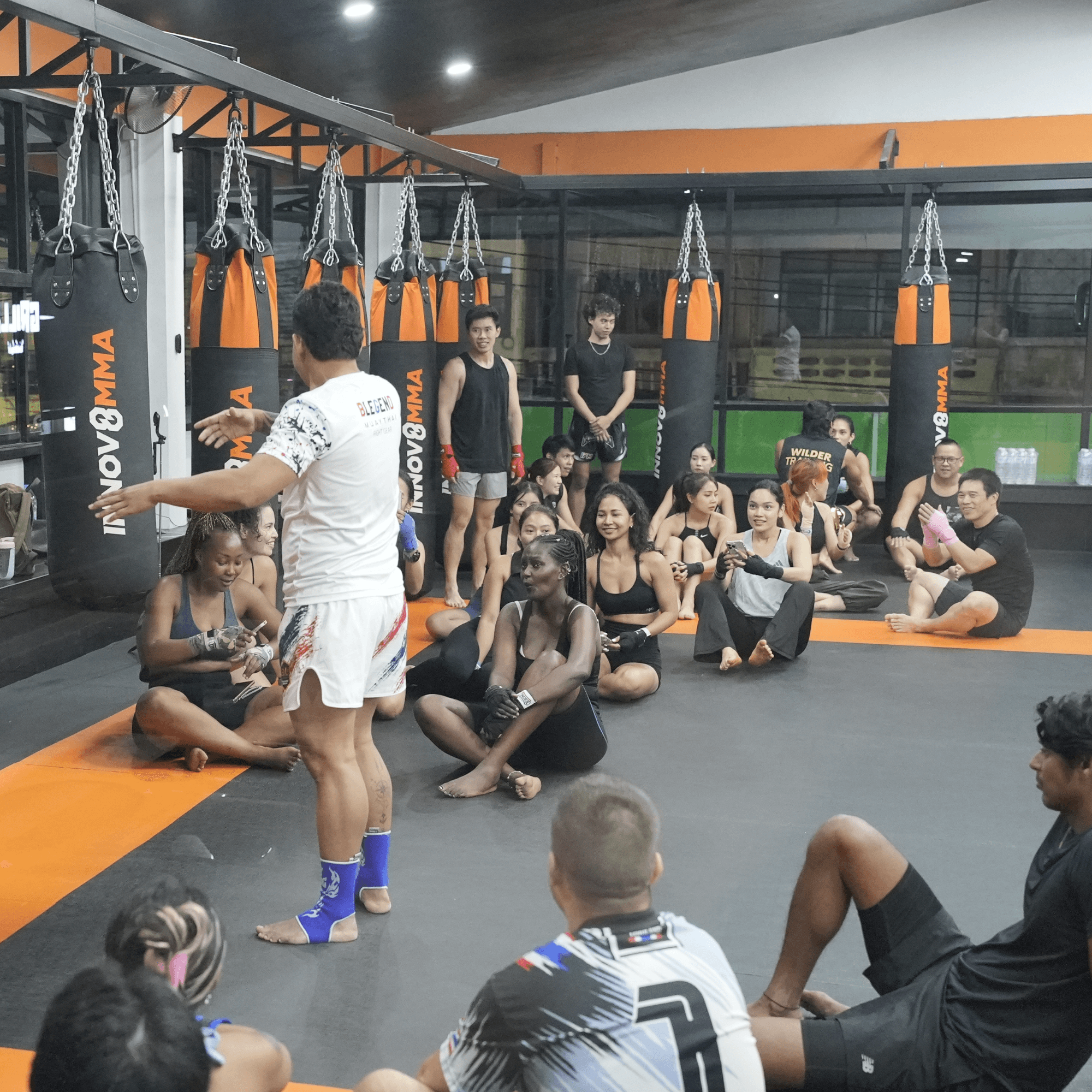A coach leading a group muay thai class