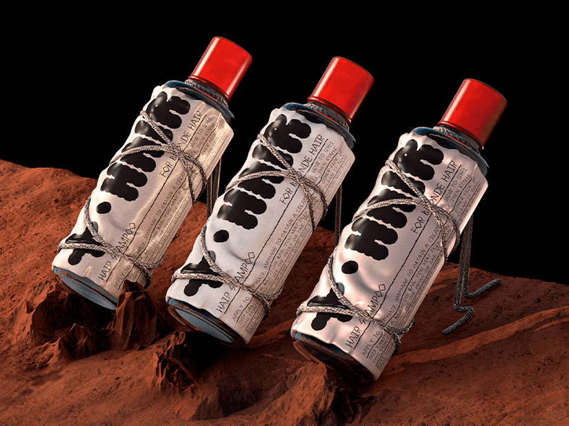 Four diverse professionals collaboratively working on a laptop, with one person pointing at the screen while others observe.