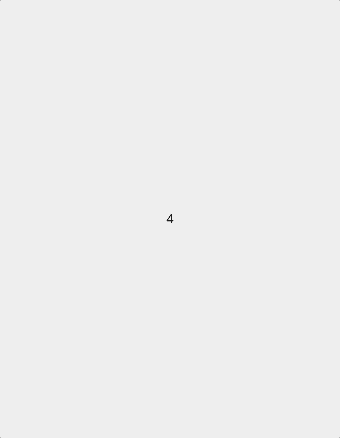 Snow falling on buildings in a city.