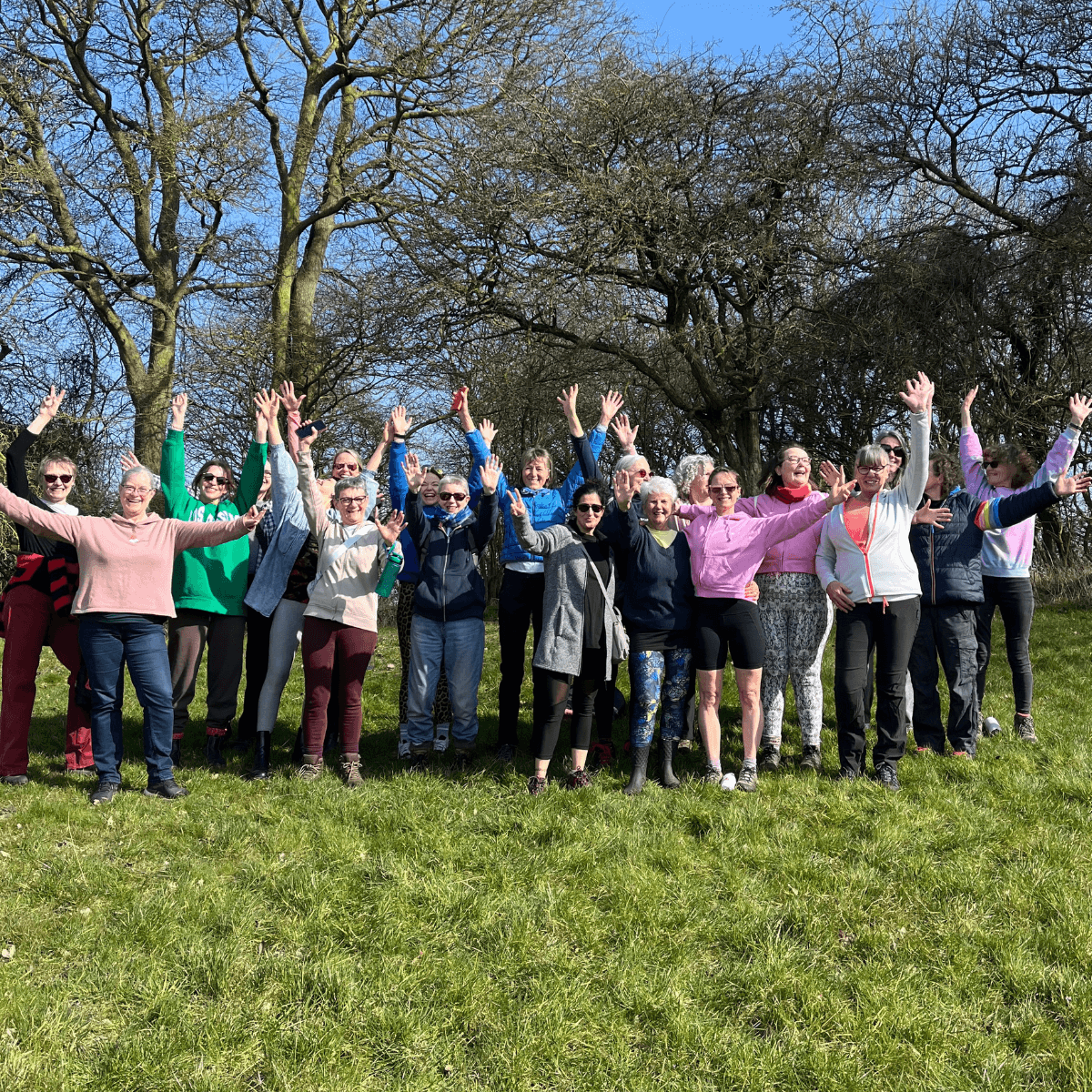 Members cheering together outdoors after a retreat walk