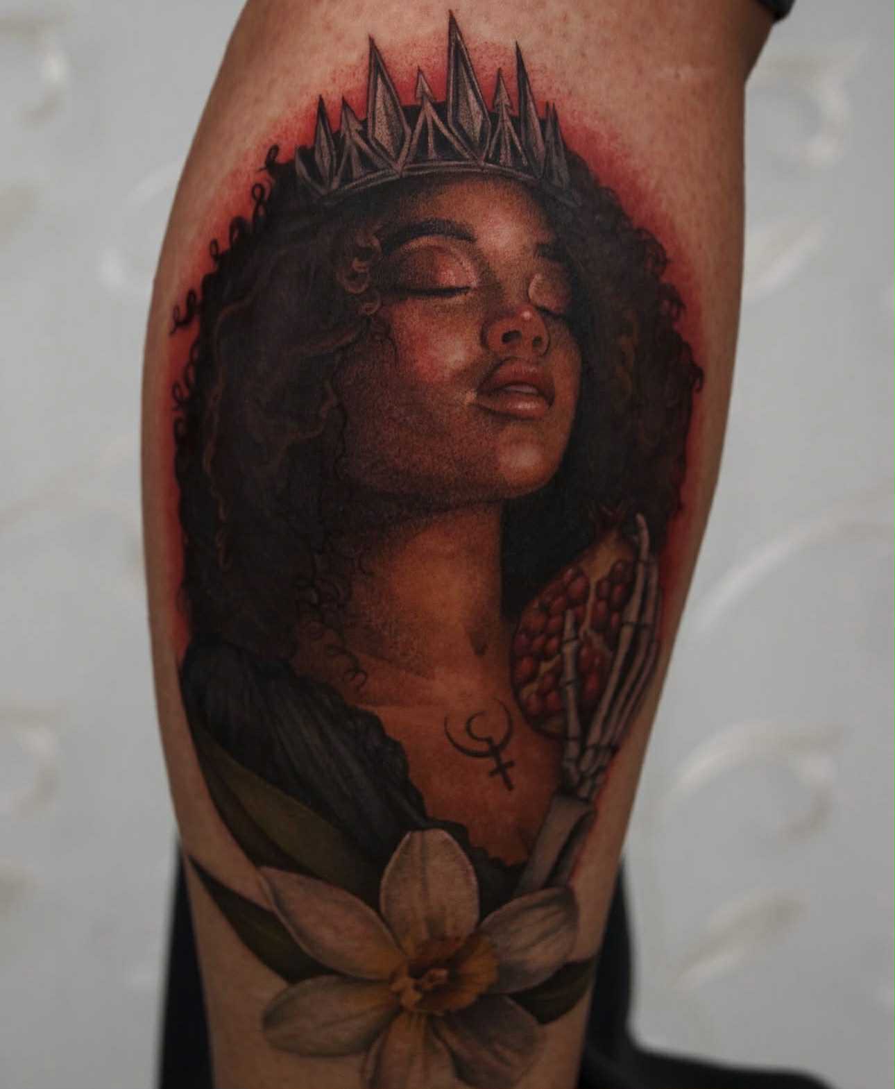 Elegant floral and butterfly tattoo with compass design.