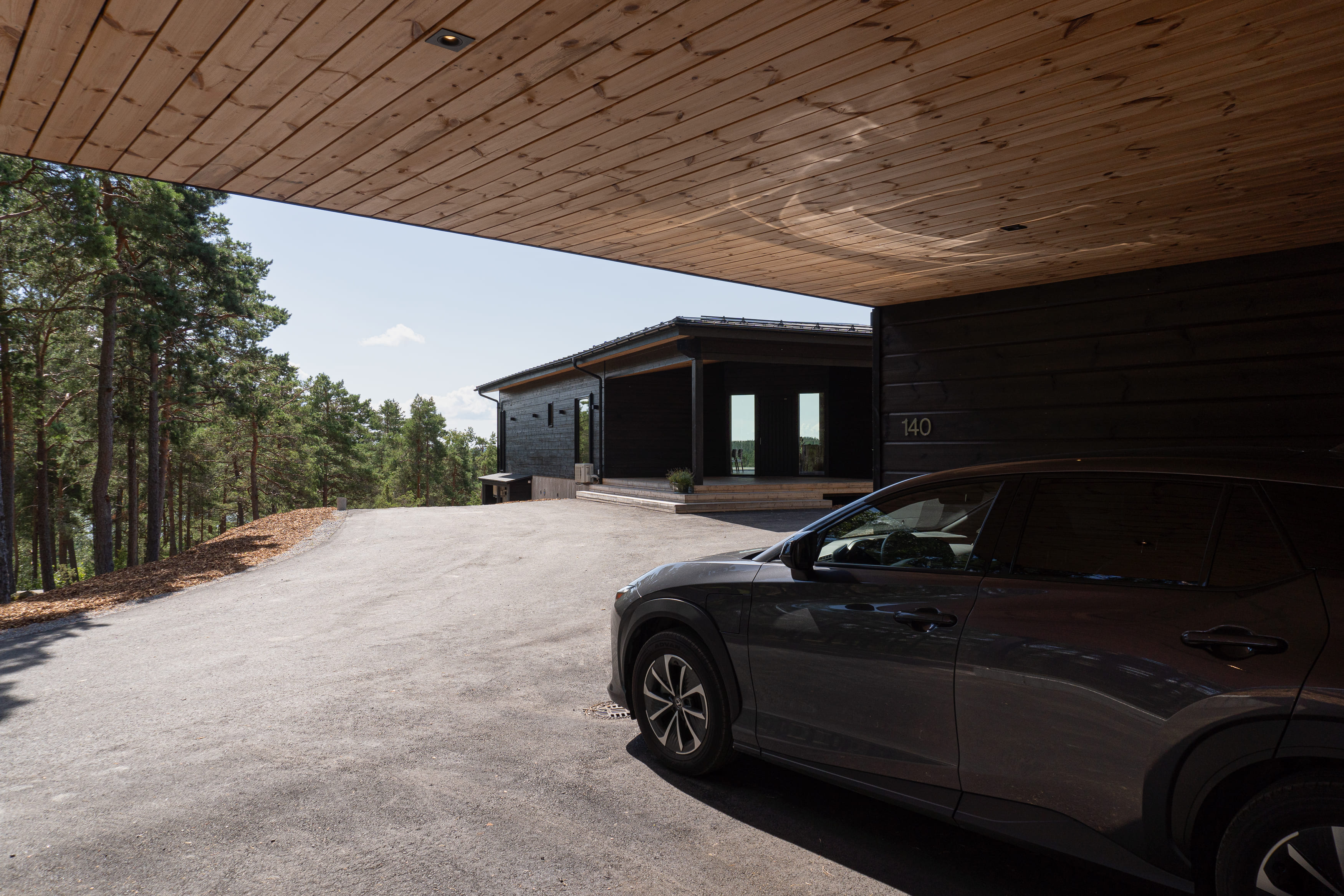 Carport of a villa and the villa behind